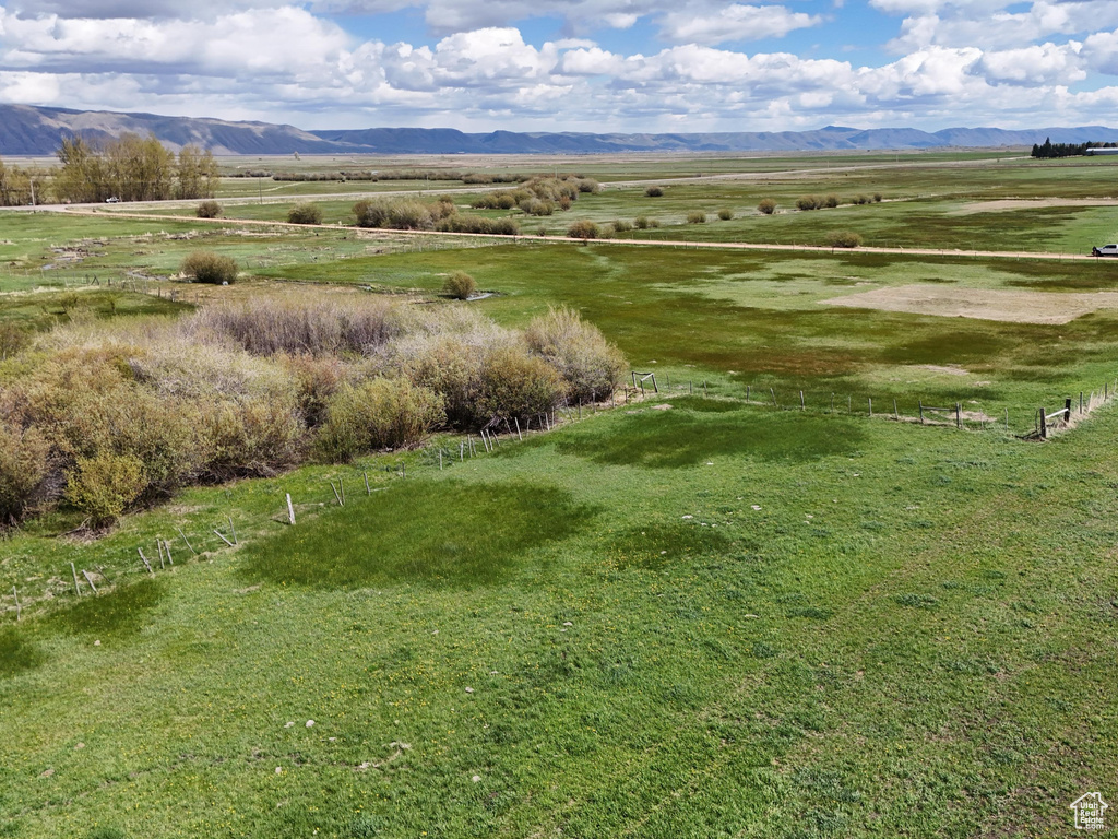 Birds eye view of property with a rural view and a mountain view