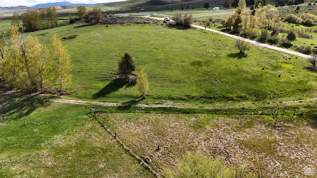 Birds eye view of property with a rural view
