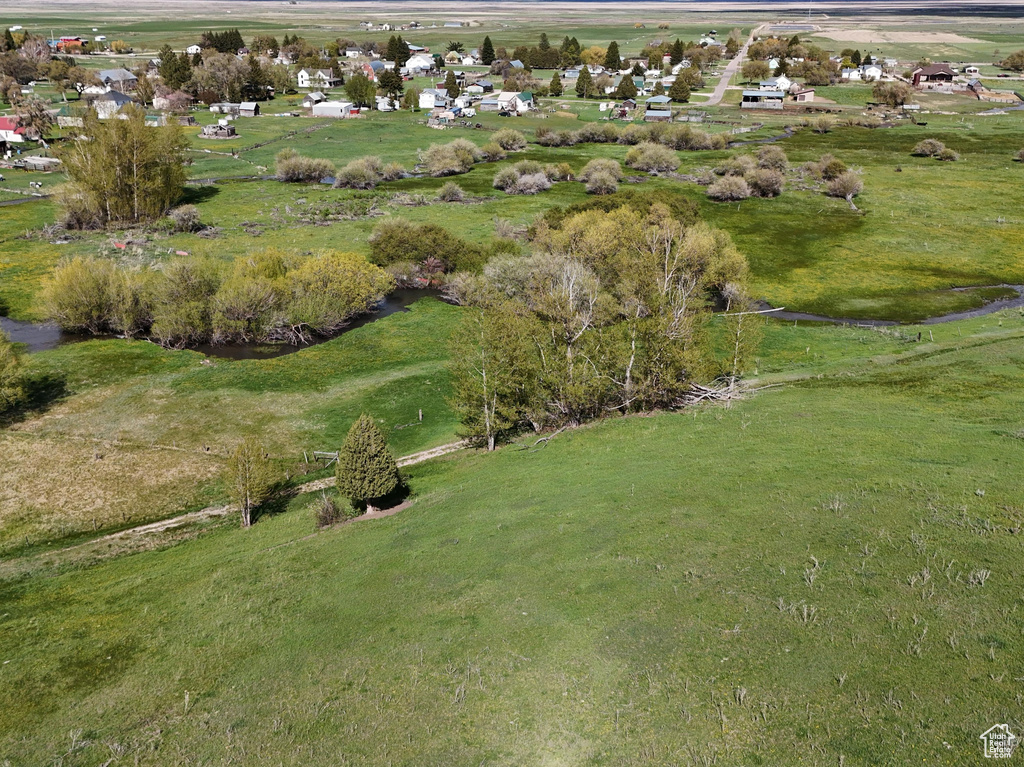 Birds eye view of property with a rural view