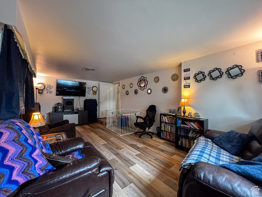 Living room with hardwood / wood-style floors