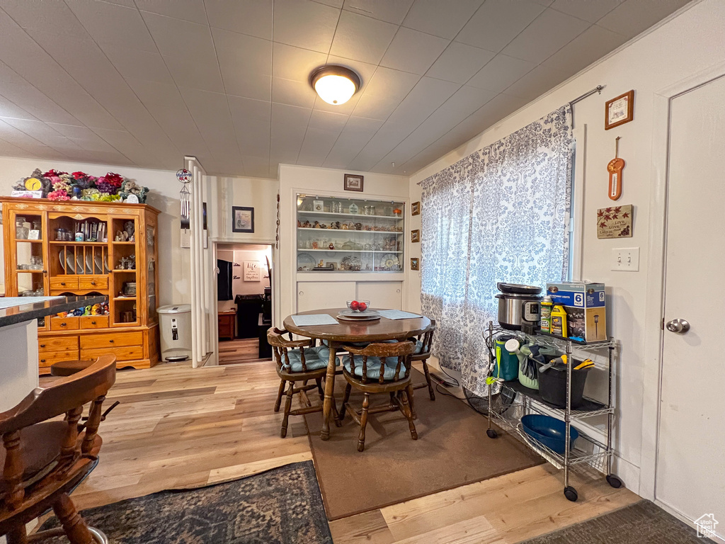 Dining space with light wood-type flooring