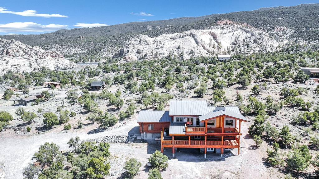 Birds eye view of property with a mountain view