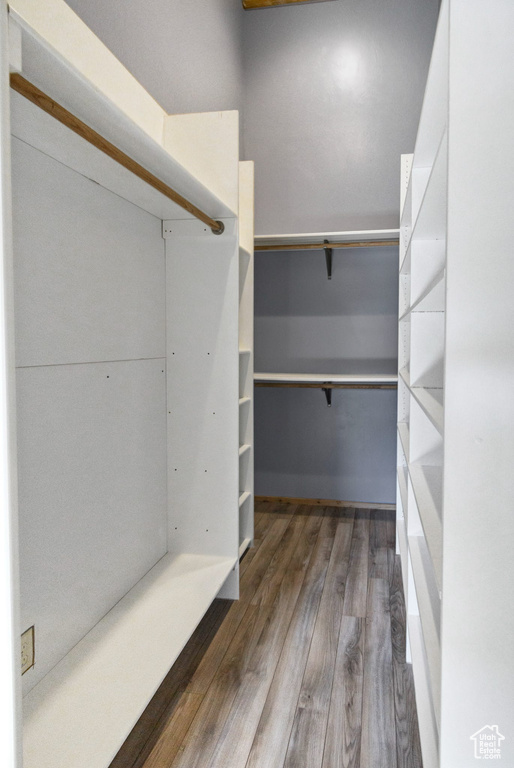 Spacious closet with wood finished floors