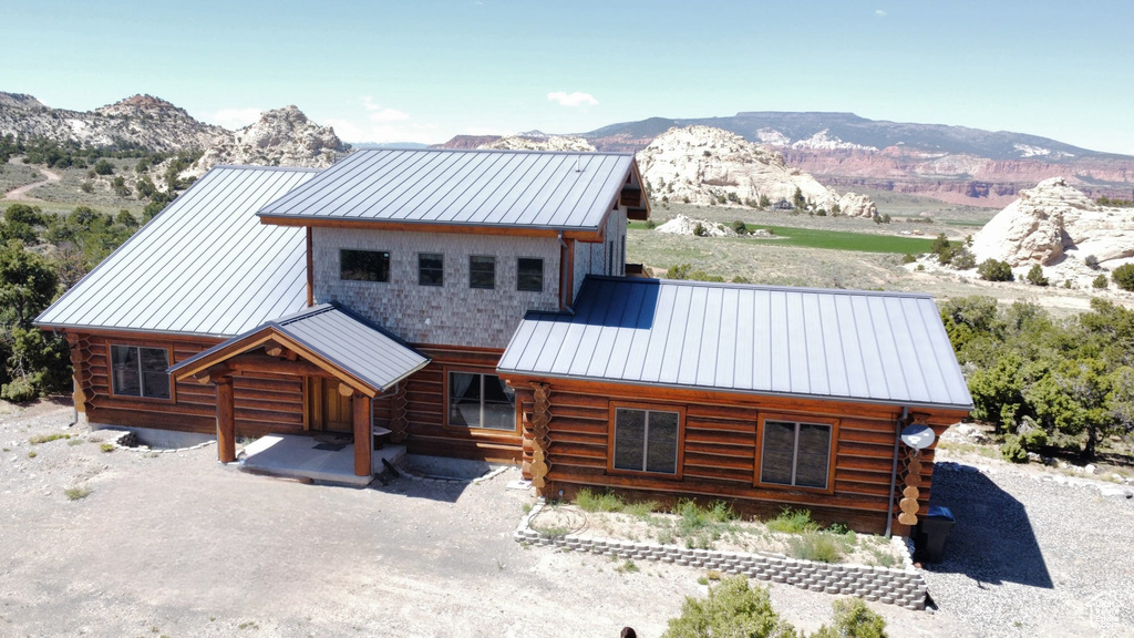 Log-style house with a mountain view