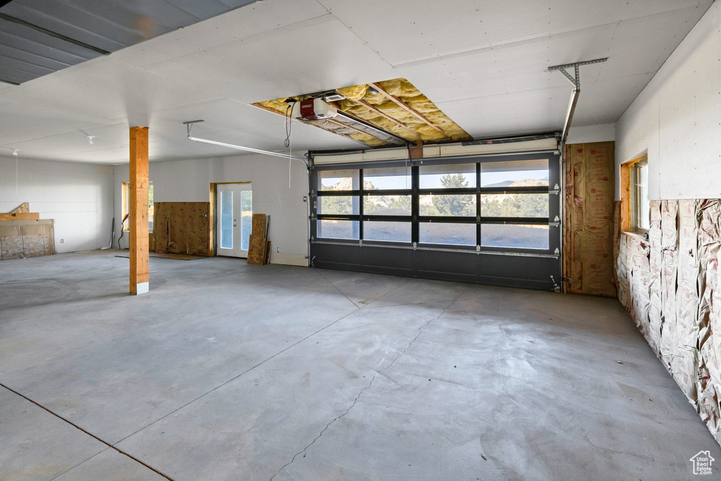 Garage featuring a garage door opener