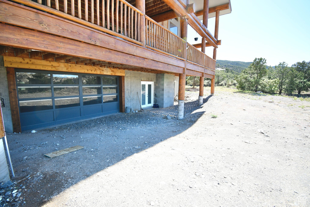View of property exterior featuring a deck