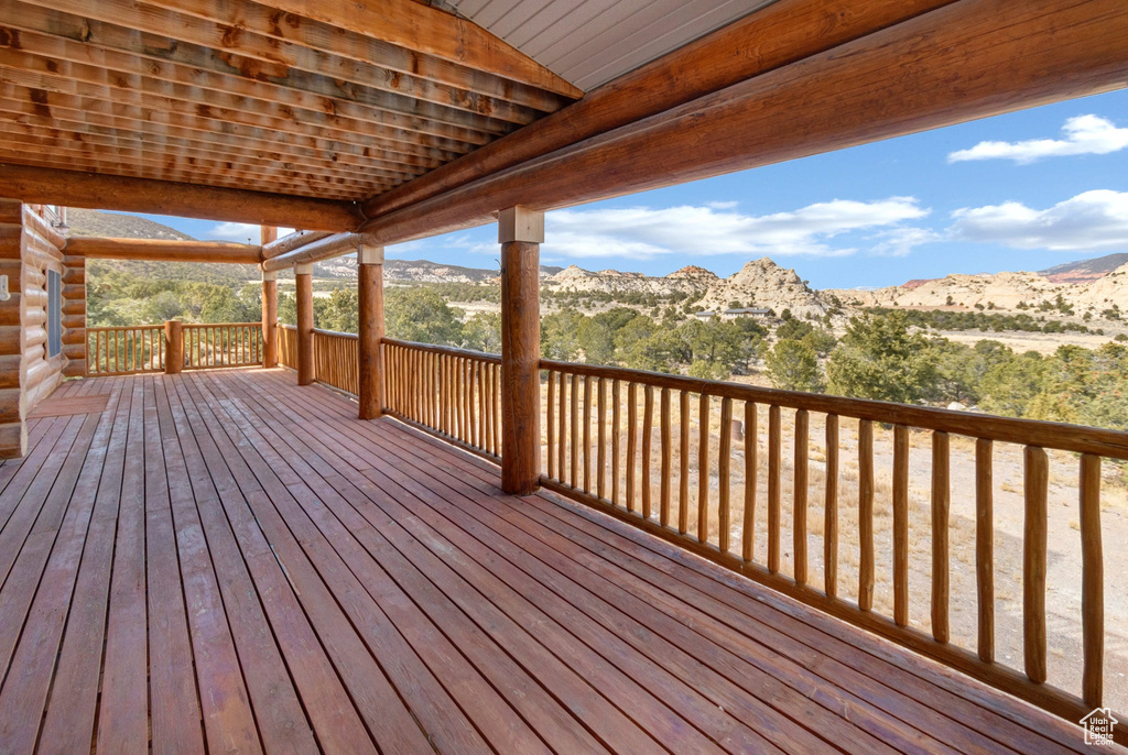 Wooden terrace featuring a mountain view