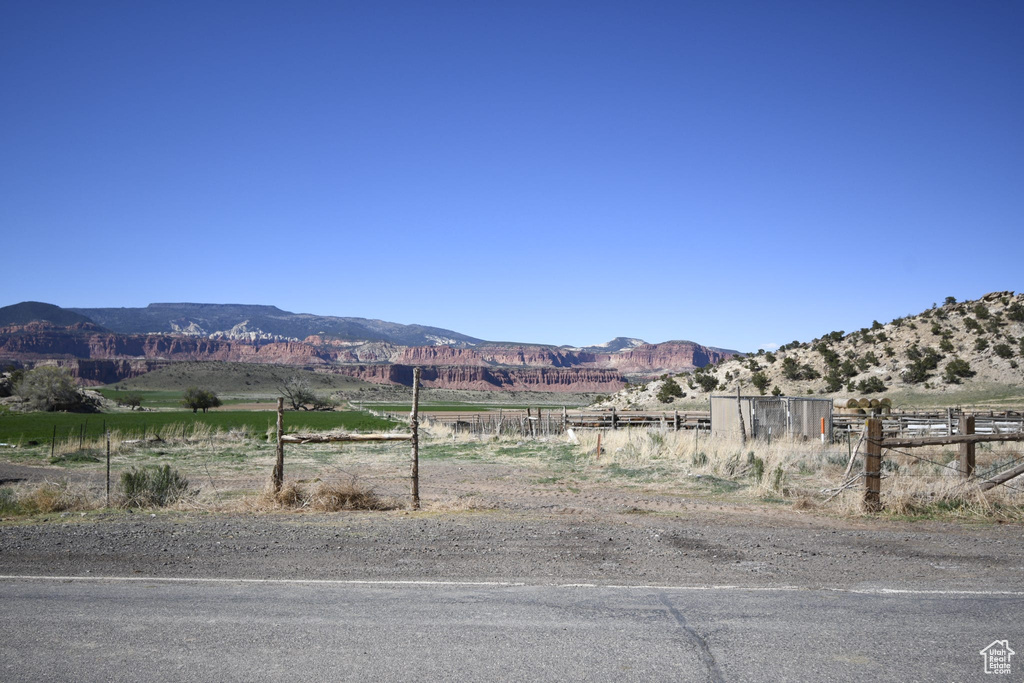 Property view of mountains with a rural view