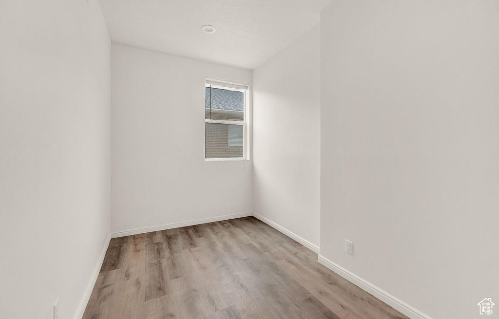 Unfurnished room with wood-type flooring