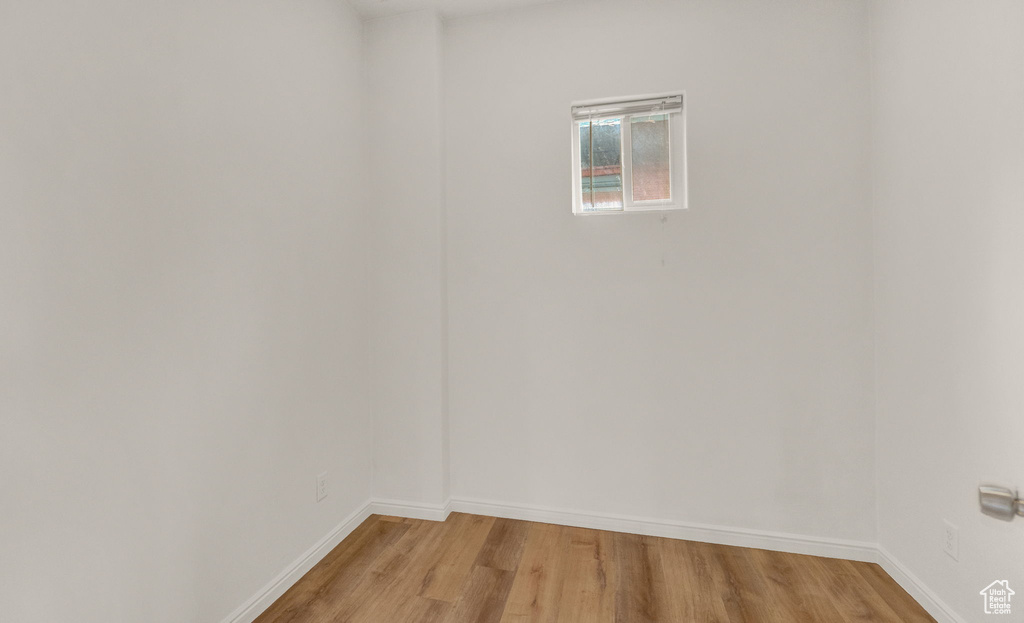 Unfurnished room with light wood-type flooring