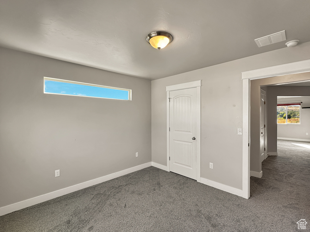 Unfurnished bedroom featuring carpet floors