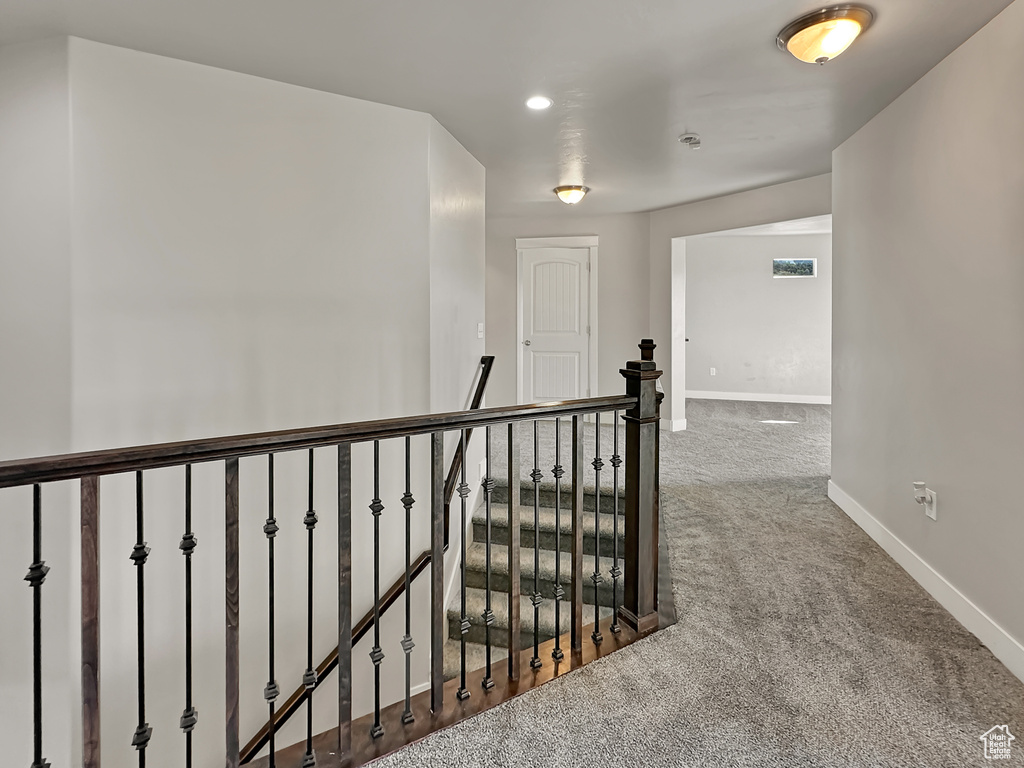 Corridor featuring carpet floors