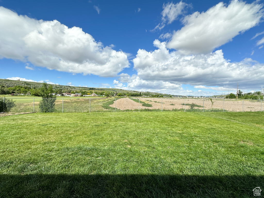 View of yard with a rural view