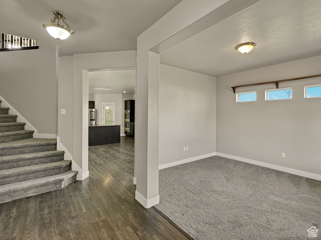 Spare room featuring dark hardwood / wood-style floors