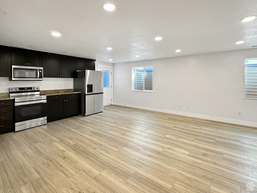 Kitchen featuring stainless steel appliances and light wood-type flooring