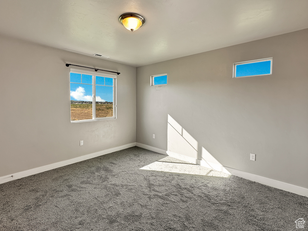 View of carpeted spare room