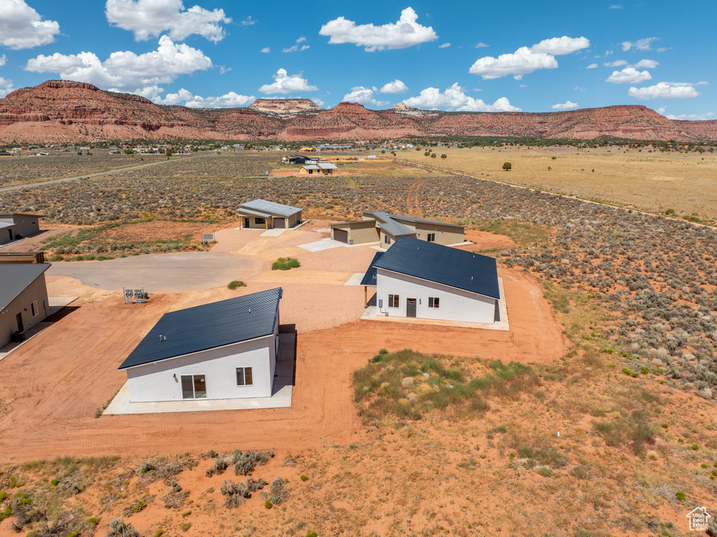 Birds eye view of property featuring a mountain view