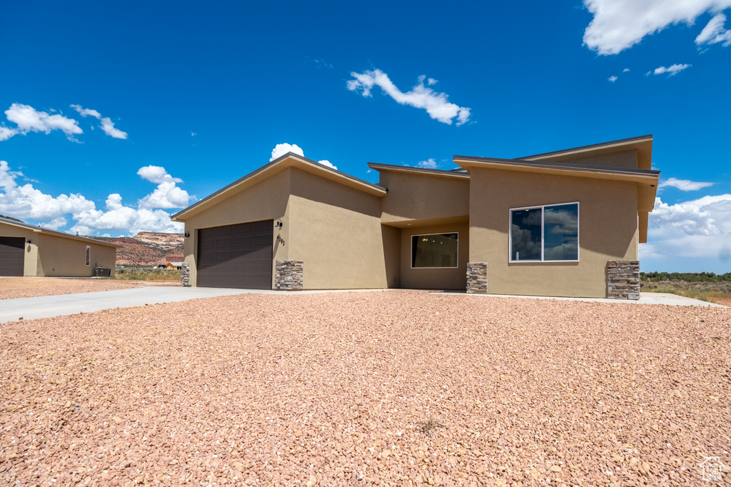 View of front of property featuring a garage