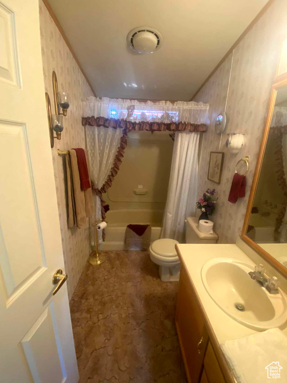 Full bathroom featuring tile floors, shower / tub combo with curtain, oversized vanity, and toilet