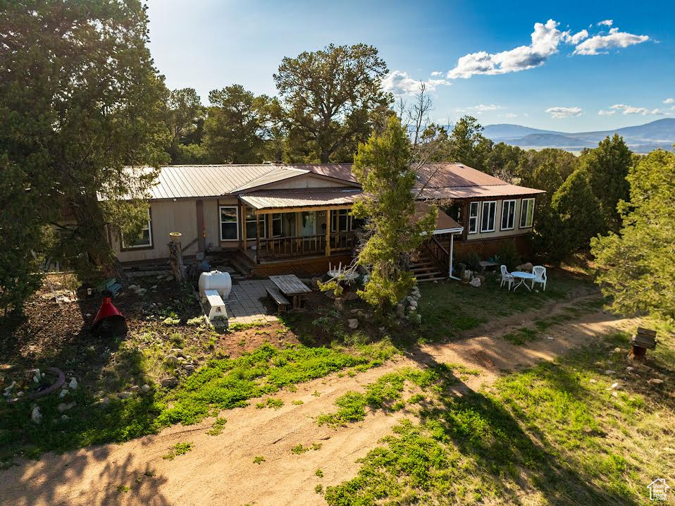 Back of house featuring a deck