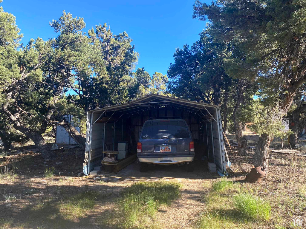 Exterior space featuring a carport