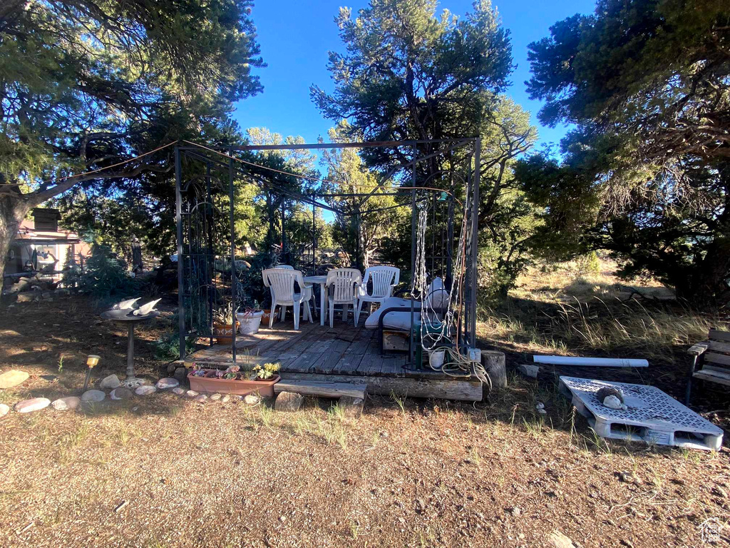 View of yard featuring a wooden deck