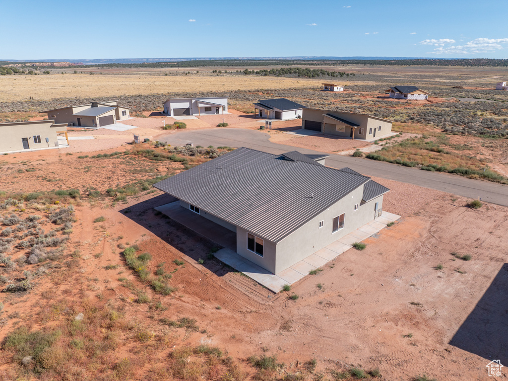 Birds eye view of property with a rural view