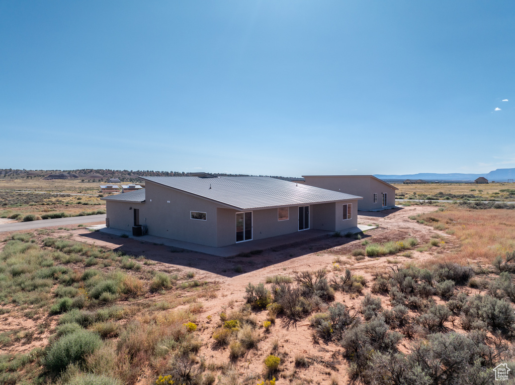 Rear view of house featuring a mountain view