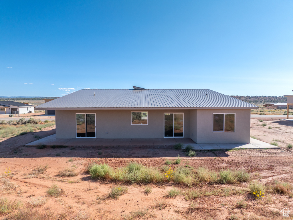 Rear view of house featuring a patio area