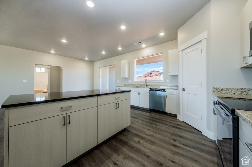 Kitchen featuring black electric range oven, sink, white cabinetry, dishwasher, and dark hardwood / wood-style floors