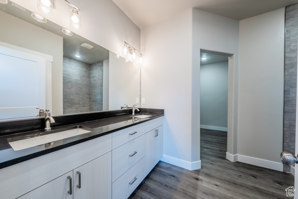 Bathroom featuring vanity and hardwood / wood-style floors