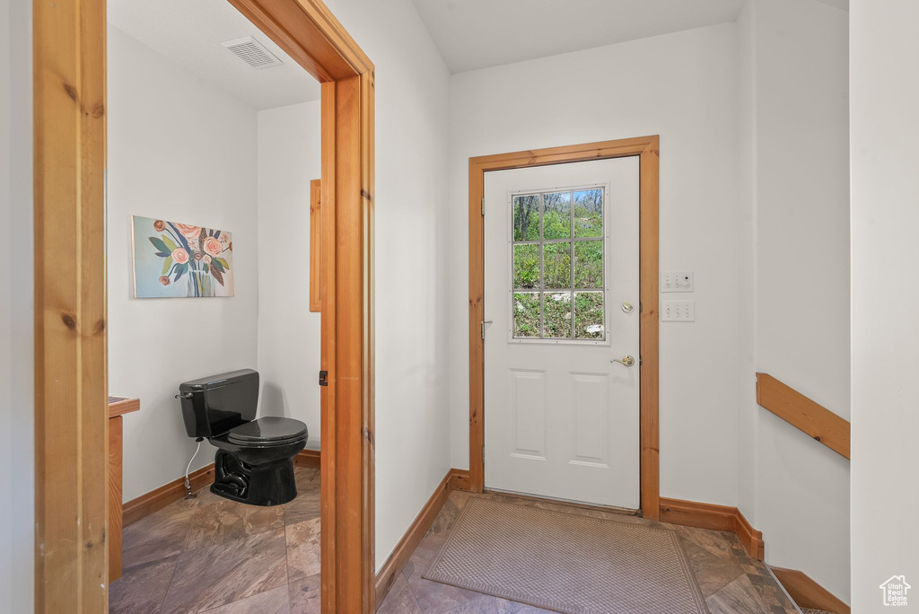 Doorway featuring tile flooring