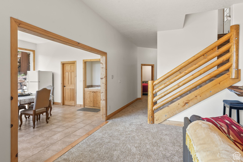 Interior space featuring ensuite bathroom and white fridge