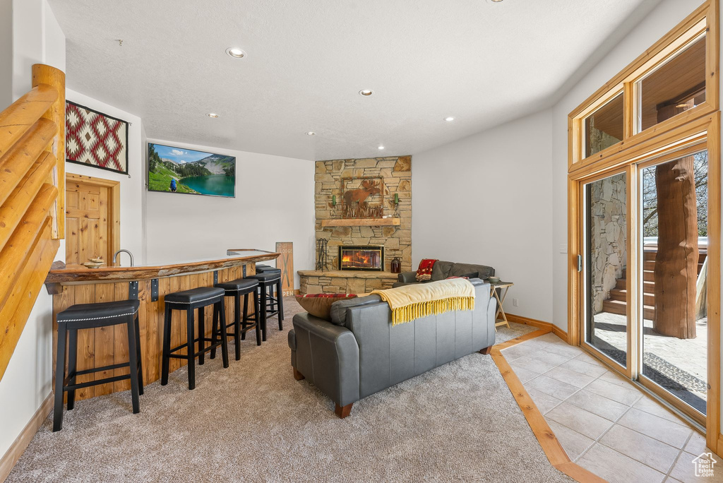 Living room with a stone fireplace