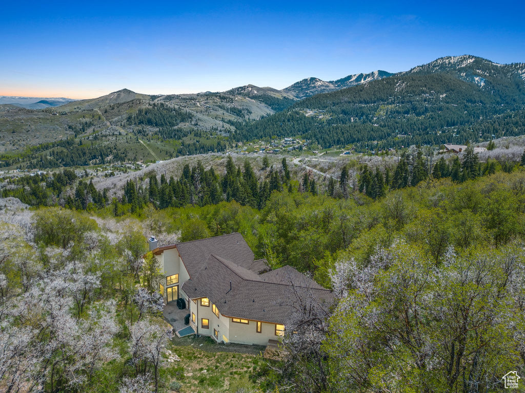 Aerial view at dusk featuring a mountain view