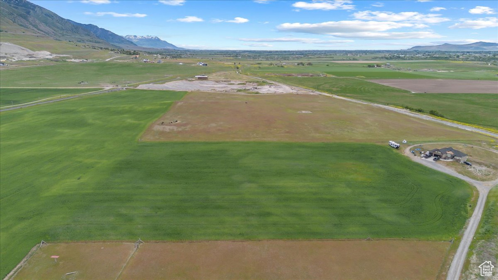 Birds eye view of property with a rural view and a mountain view