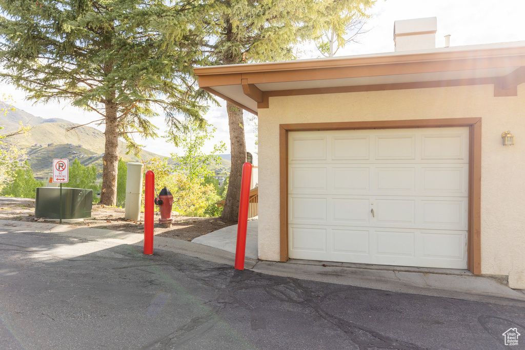 Garage featuring a mountain view