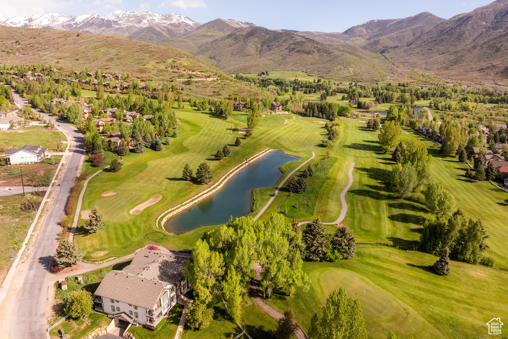 Aerial view featuring a water and mountain view