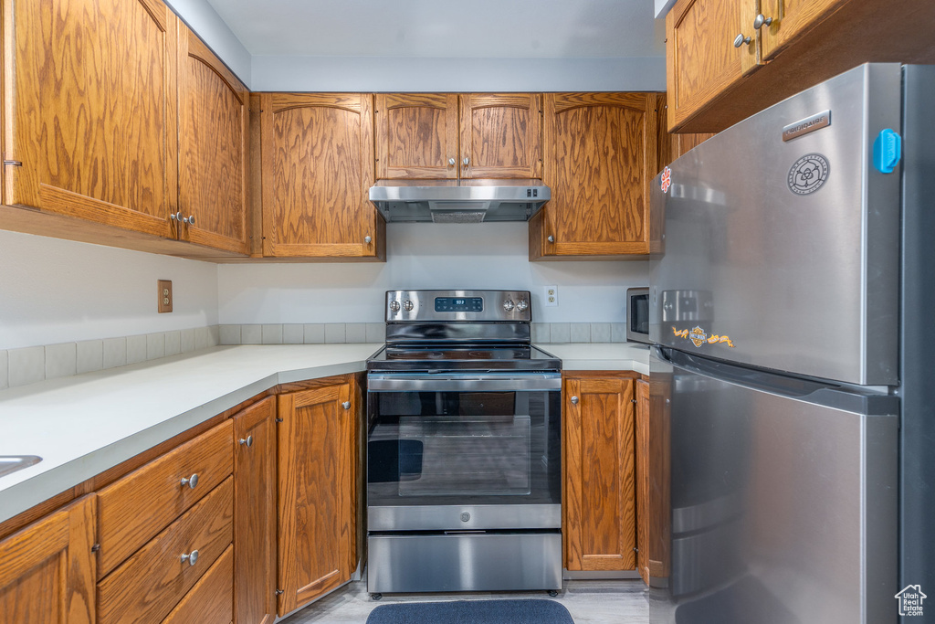 Kitchen with appliances with stainless steel finishes