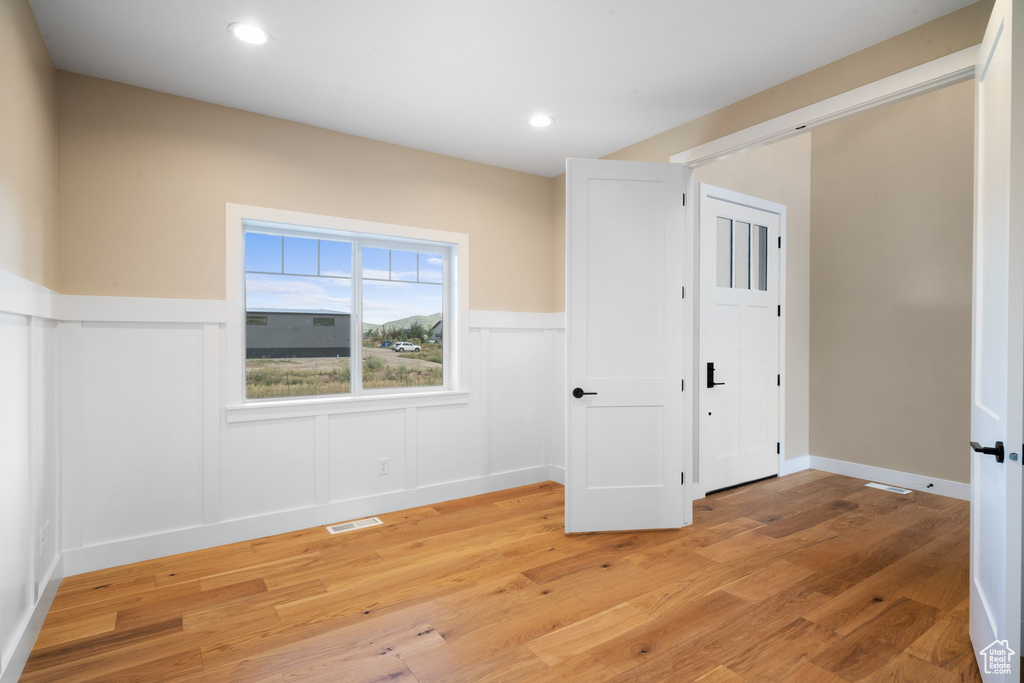 Empty room featuring light wood-type flooring