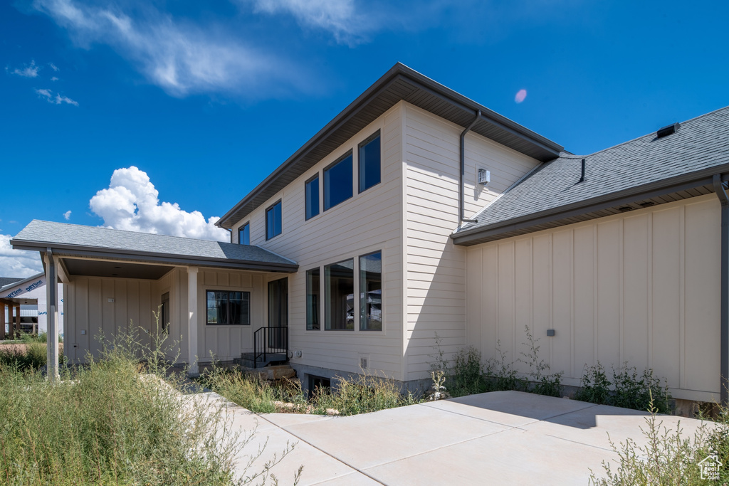 Rear view of property featuring a patio