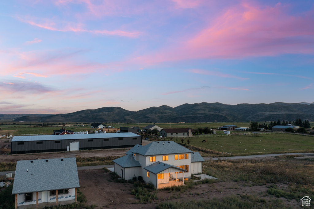 Aerial view at dusk featuring a mountain view