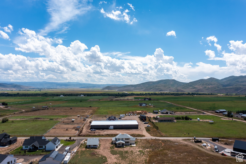 Birds eye view of property with a rural view and a mountain view