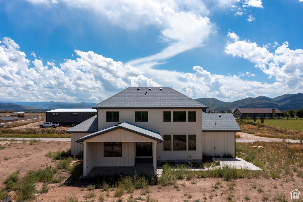 Back of house with a mountain view