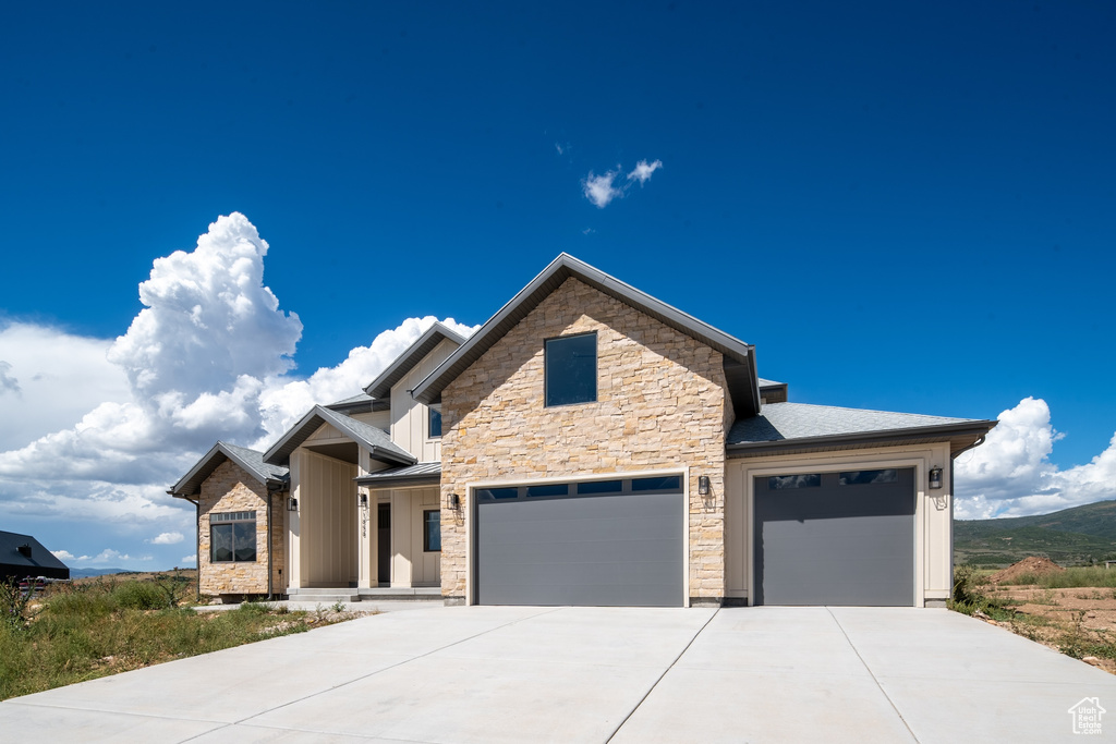 View of front of home featuring a garage