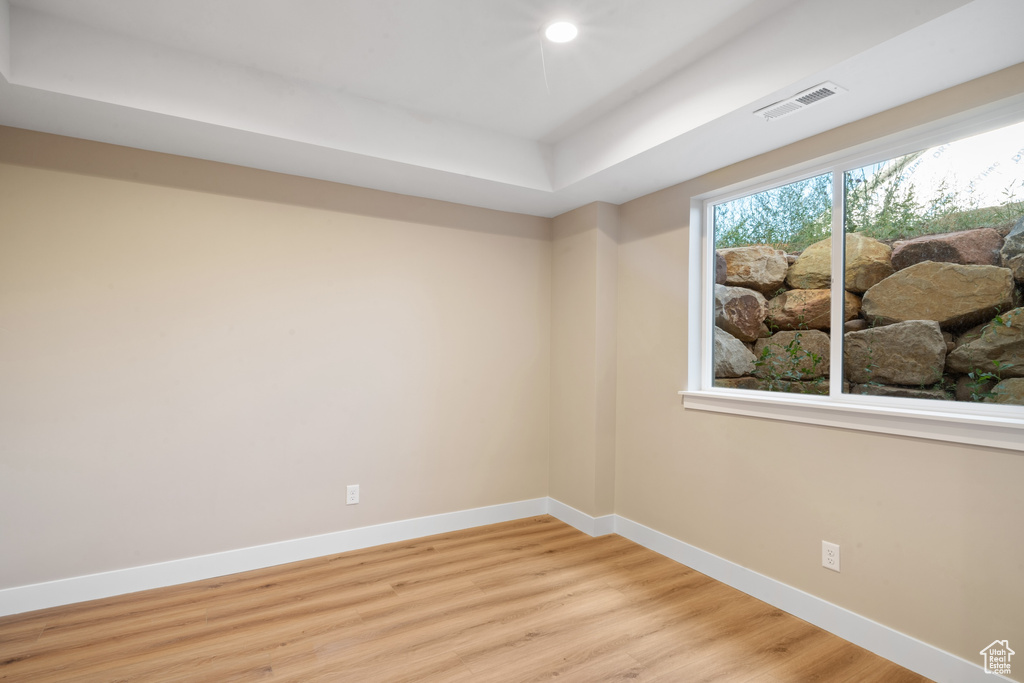 Spare room with light hardwood / wood-style flooring