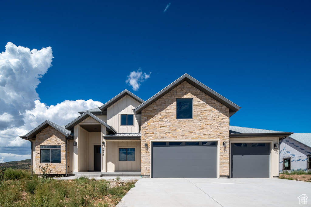 View of front of home featuring a garage