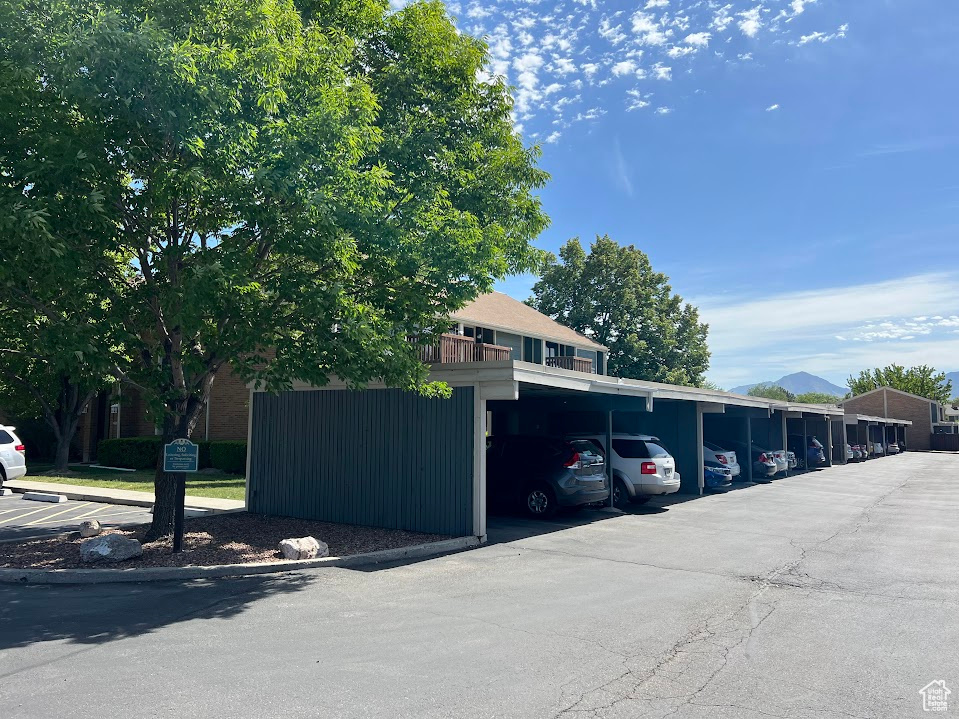 View of car parking featuring a carport