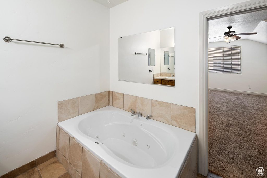 Bathroom with vanity, ceiling fan, and tile floors