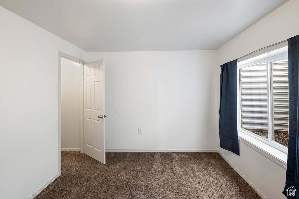 Empty room with dark carpet